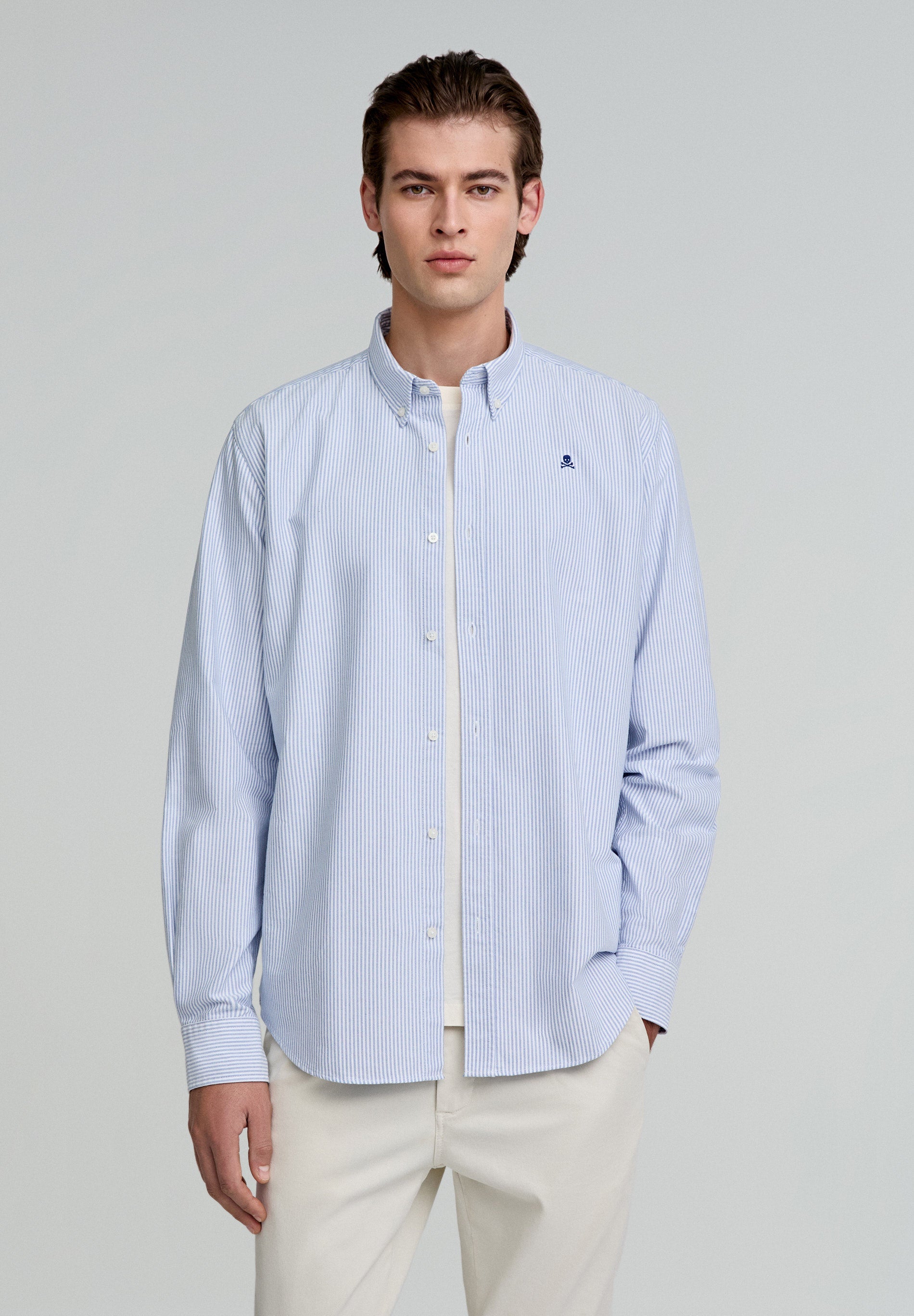 CAMISA OXFORD ÀS RISCAS SKULL