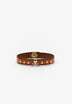 PULSEIRA COM LOGÓTIPO E TACHAS