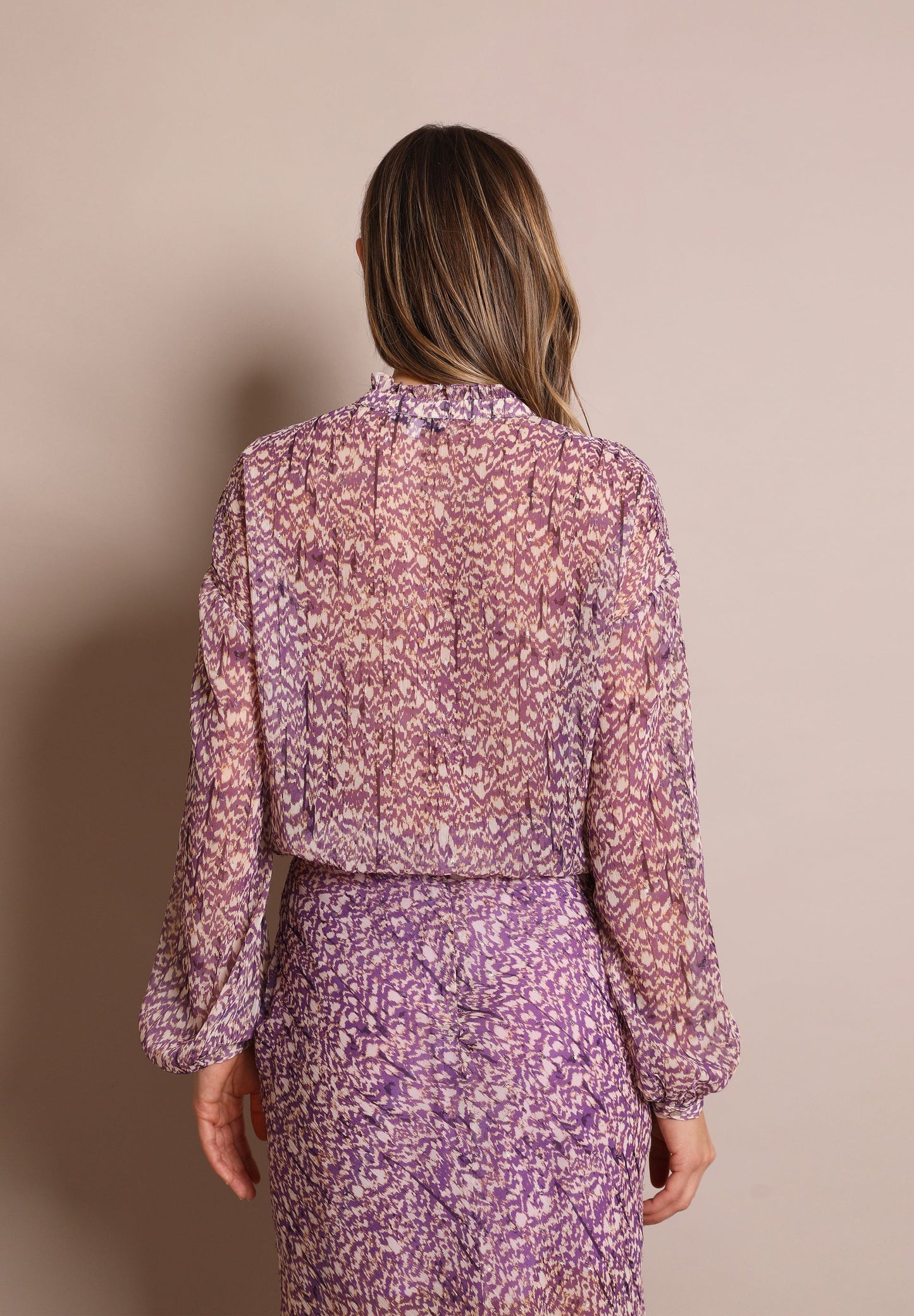 BLUSA COM PADRÃO METALIZADO