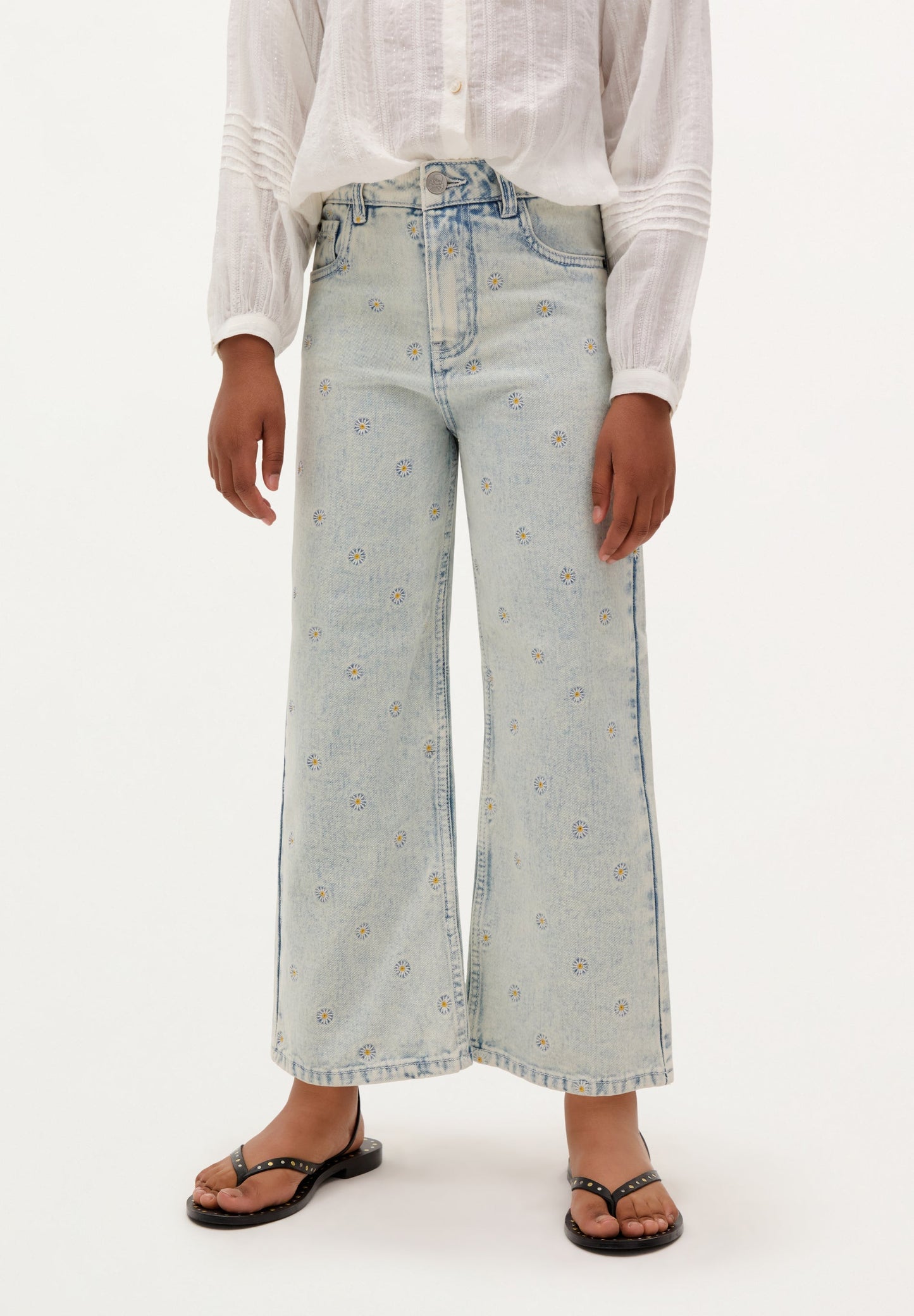 CALÇAS DENIM COM BORDADOS DE SÓIS