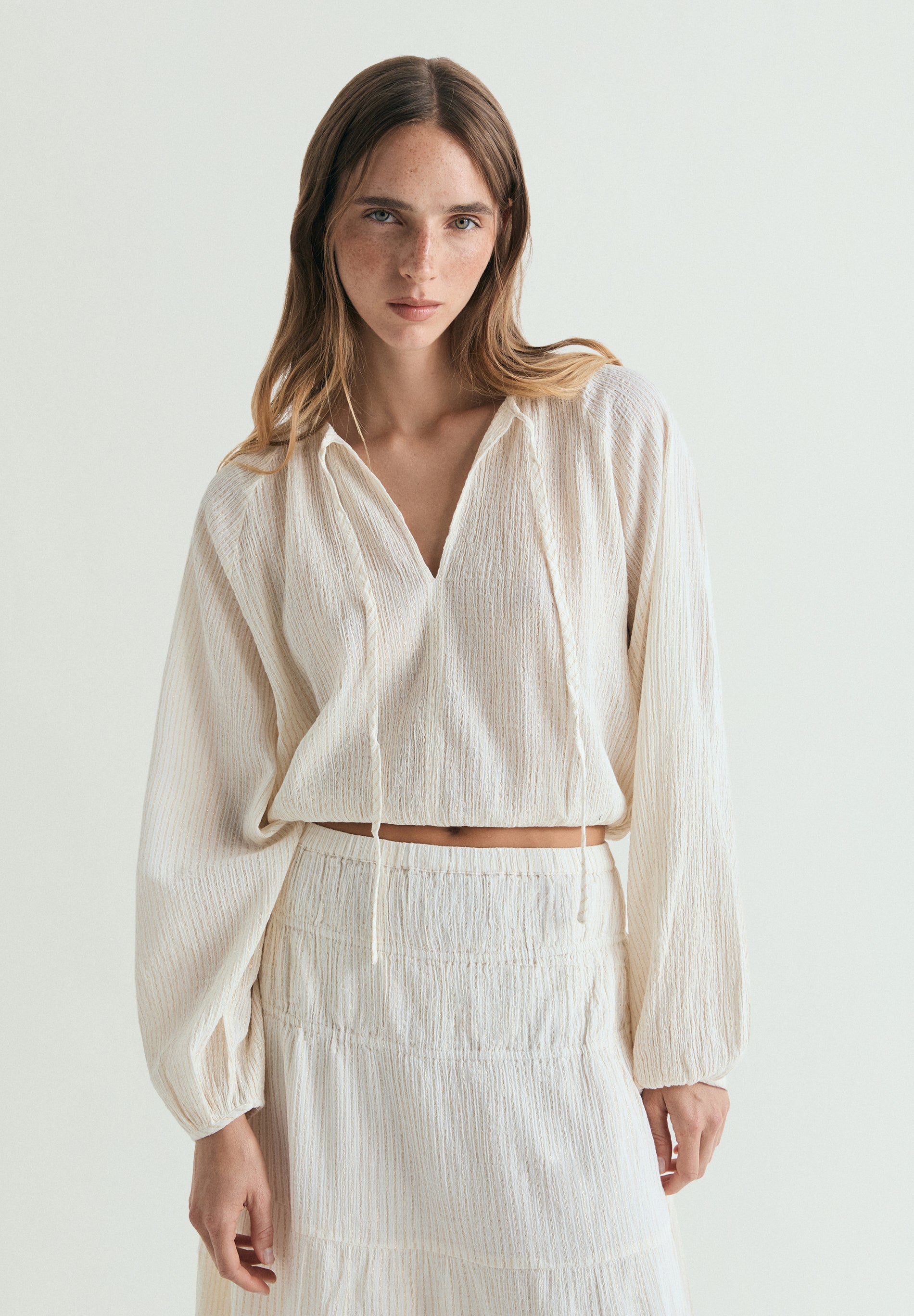 BLUSA ÀS RISCAS EM FIO METALIZADO