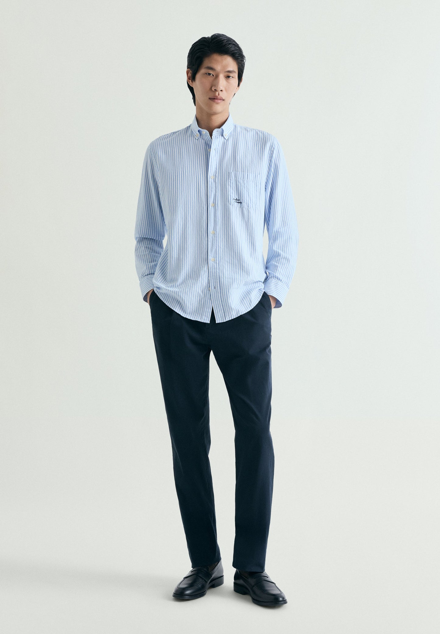 CAMISA ÀS RISCAS COM BOLSO
