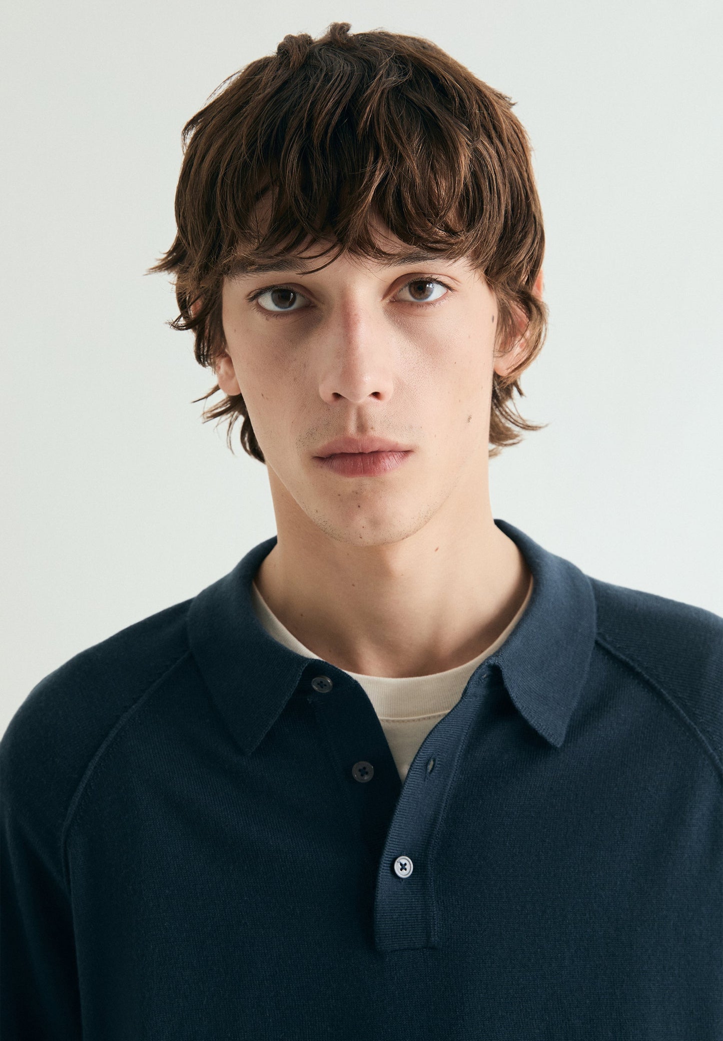 SWEATER COM TIPO CAMISA POLO RAGLÃ