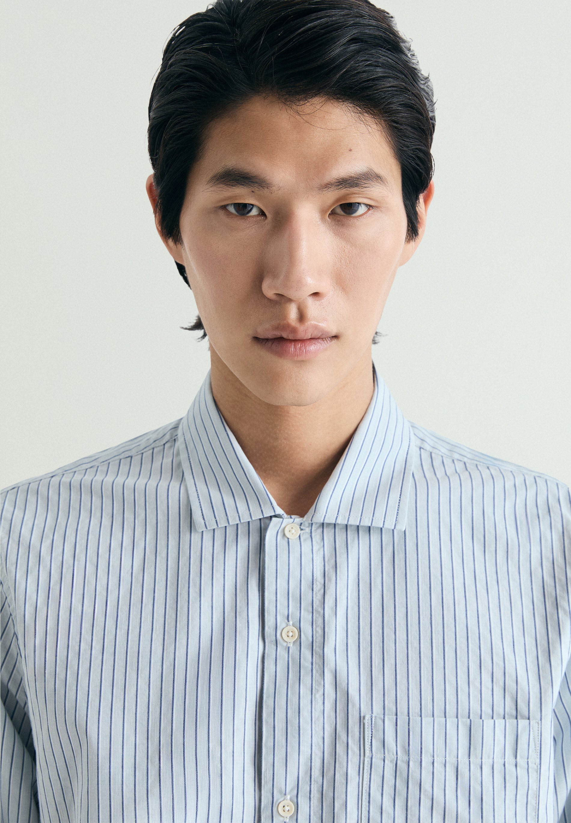 CAMISA ÀS RISCAS COM BOLSO