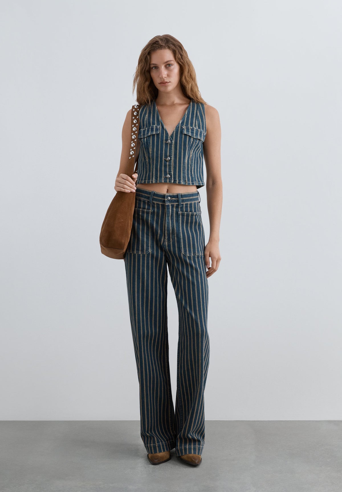 COLETE DENIM ÀS RISCAS