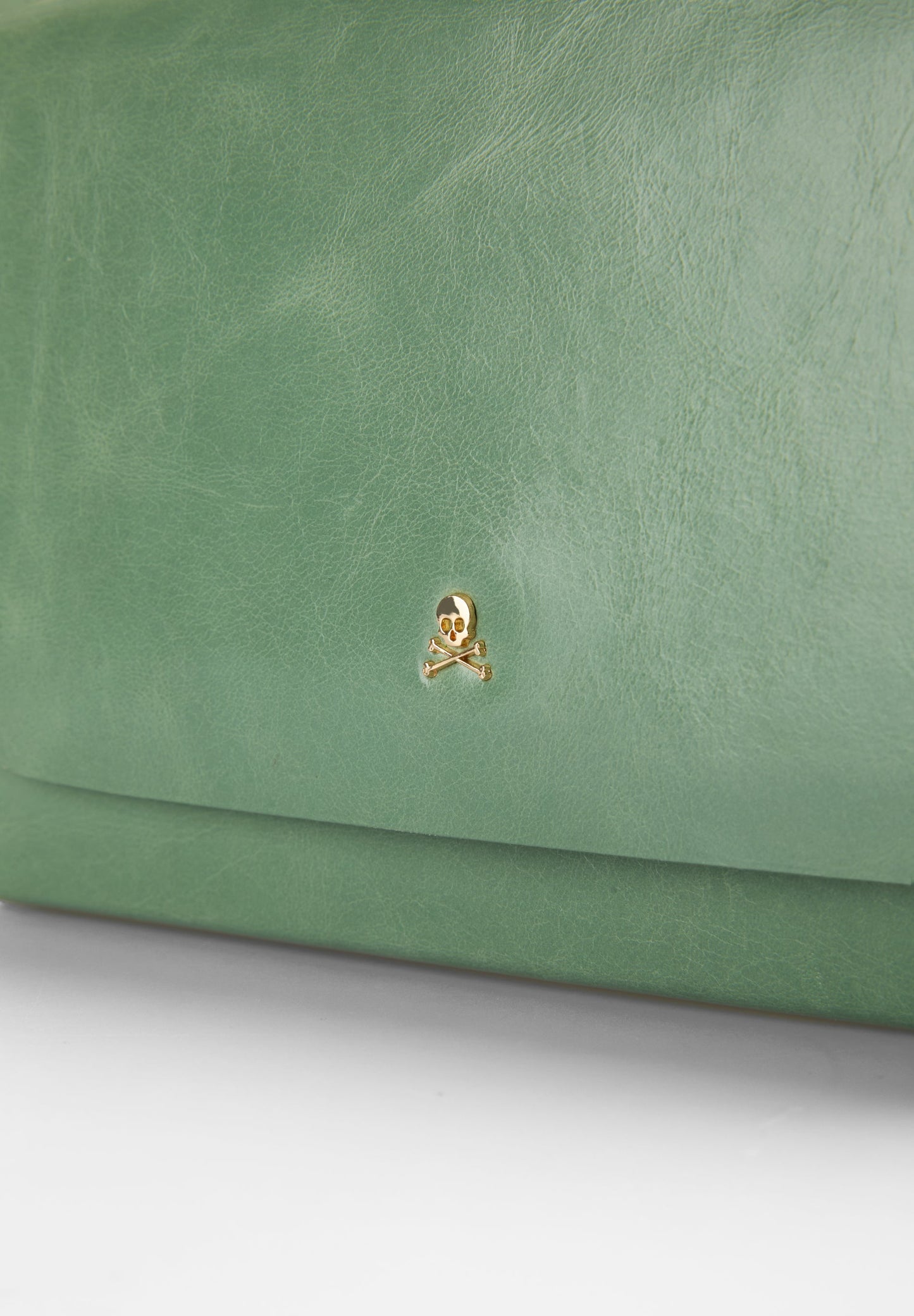 BOLSA MINI EM PELE COM TACHAS