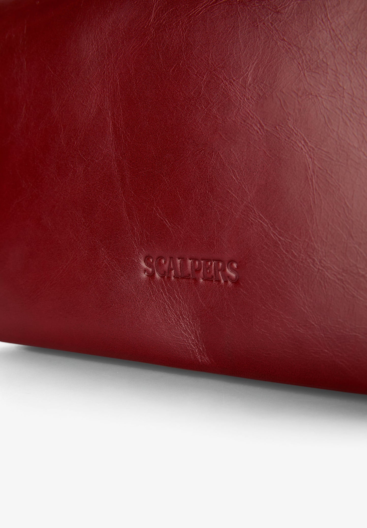BOLSA MINI EM PELE COM TACHAS