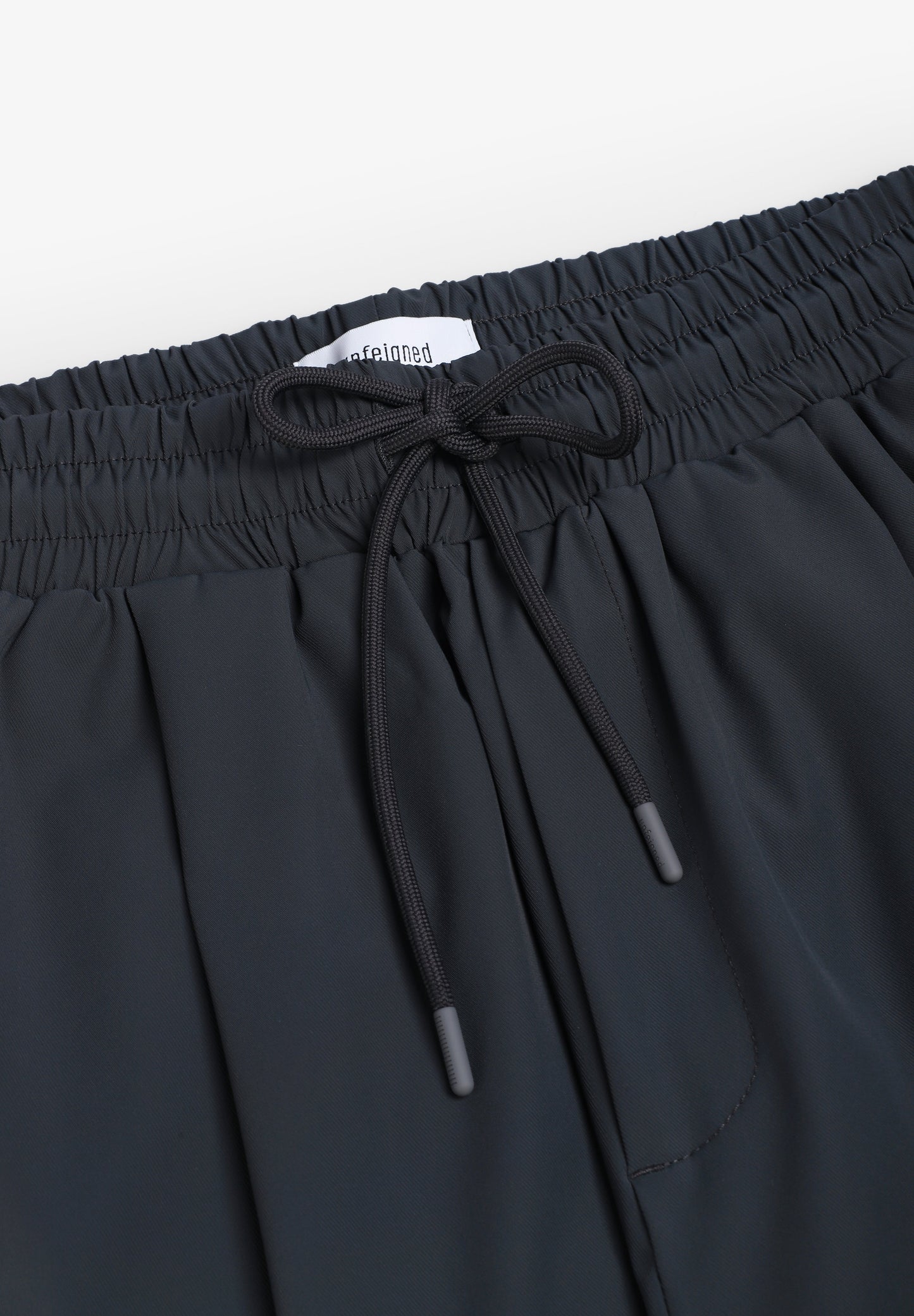 UNFEIGNED | CALÇAS SMART TECHNICAL N WR